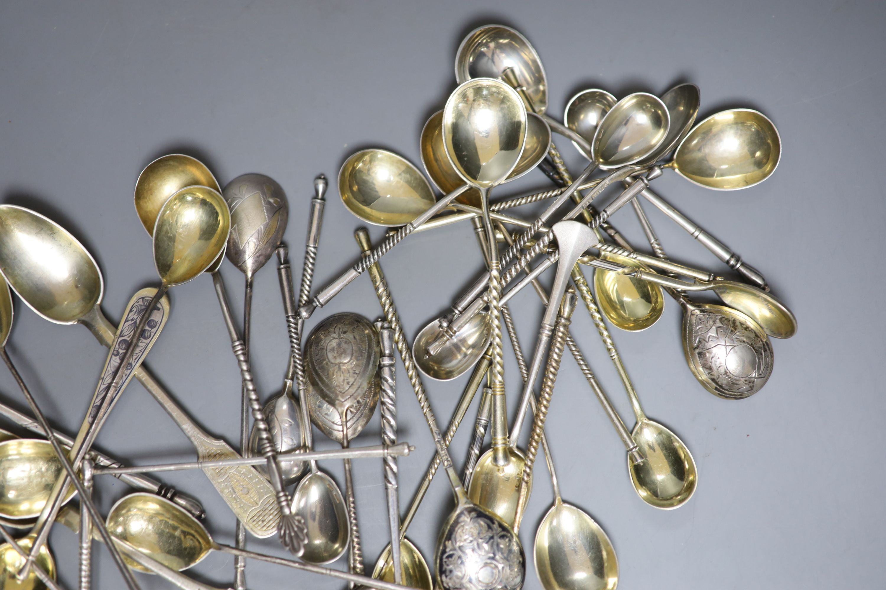 A late 19th century Russian 84 zolotnik and niello belt buckle and a quantity of assorted Russian 84 zolotnik teaspoons etc.